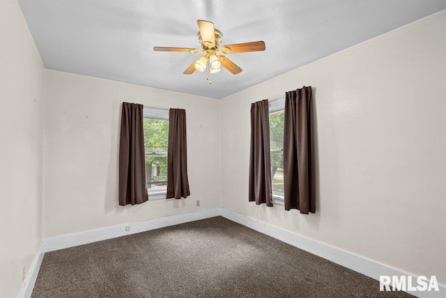 546 21st Ave, Moline, IL 61265 - carpeted empty room featuring baseboards and a ceiling fan