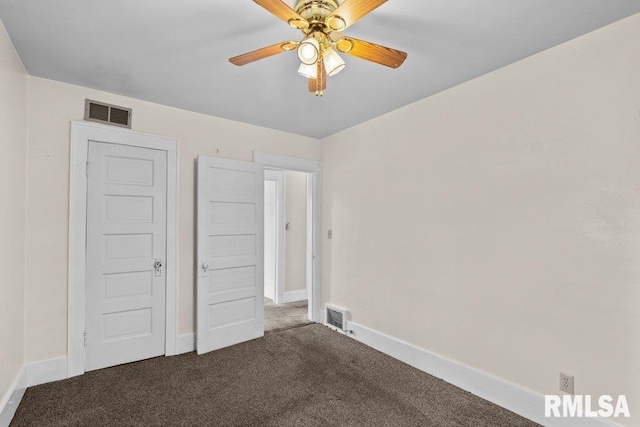 546 21st Ave, Moline, IL 61265 - unfurnished bedroom with carpet, baseboards, and ceiling fan