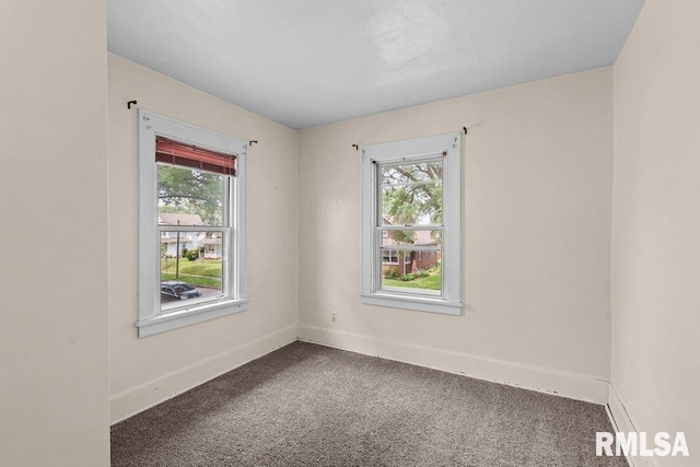 546 21st Ave, Moline, IL 61265 - carpeted spare room with healthy amount of natural light and baseboards