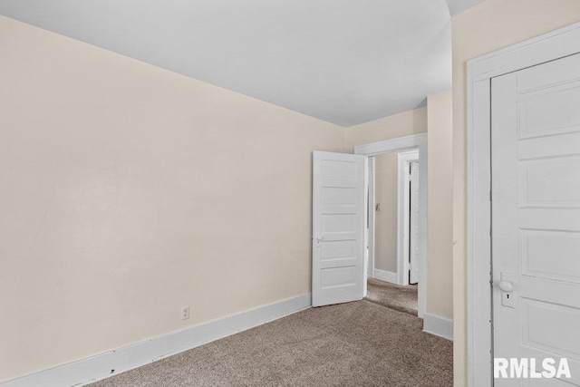546 21st Ave, Moline, IL 61265 - unfurnished bedroom featuring carpet flooring and baseboards