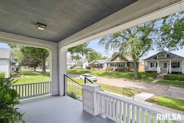 546 21st Ave, Moline, IL 61265 - wooden porch featuring a residential view