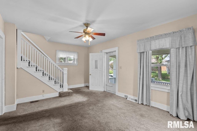 546 21st Ave, Moline, IL 61265 - entryway with stairway, ceiling fan, carpet, and baseboards