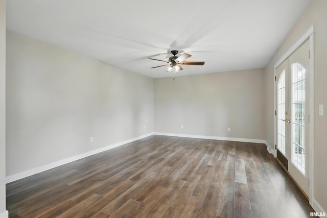 3610 Tam-O-Shanter Dr, Bettendorf, IA 52722 - spare room featuring ceiling fan, dark wood-style flooring, and baseboards