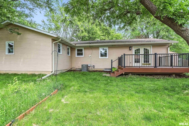 3610 Tam-O-Shanter Dr, Bettendorf, IA 52722 - back of house with a wooden deck, a yard, and central AC