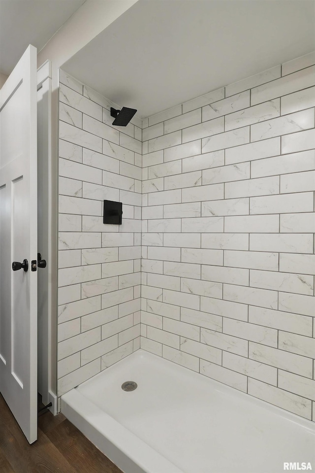 3610 Tam-O-Shanter Dr, Bettendorf, IA 52722 - bathroom with wood finished floors and tiled shower
