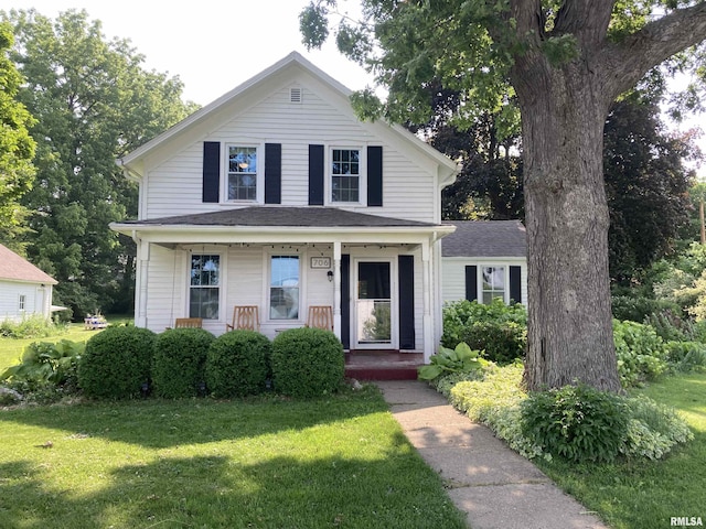 706 N Main St, Port Byron, IL 61275 - view of front of property with a front yard and a porch