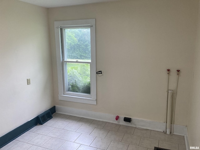 706 N Main St, Port Byron, IL 61275 - spare room featuring light tile patterned flooring