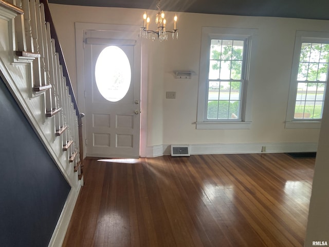 706 N Main St, Port Byron, IL 61275 - entrance foyer featuring dark wood-style floors, a chandelier, and stairs