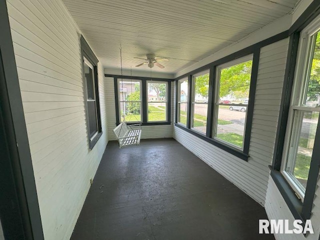 317 9th St, De Witt, IA 52742 - unfurnished sunroom featuring ceiling fan and plenty of natural light