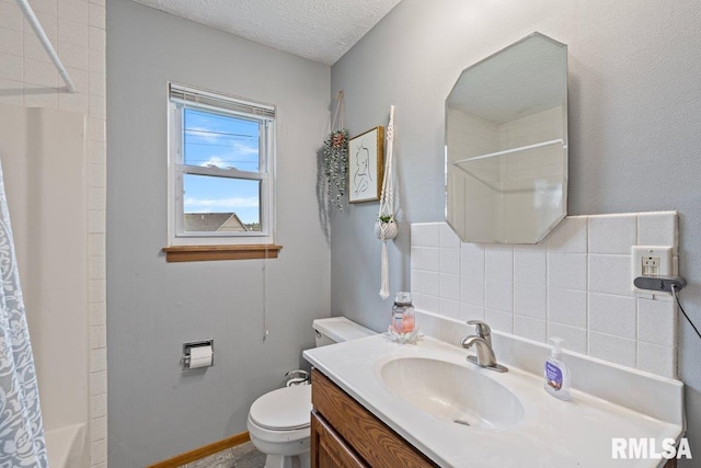 3115 W 63rd St, Davenport, IA 52806 - full bathroom with vanity, toilet, shower / bath combo with shower curtain, tile walls, and a textured ceiling