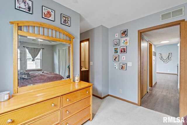 3115 W 63rd St, Davenport, IA 52806 - hall featuring baseboards, light colored carpet, and a textured ceiling
