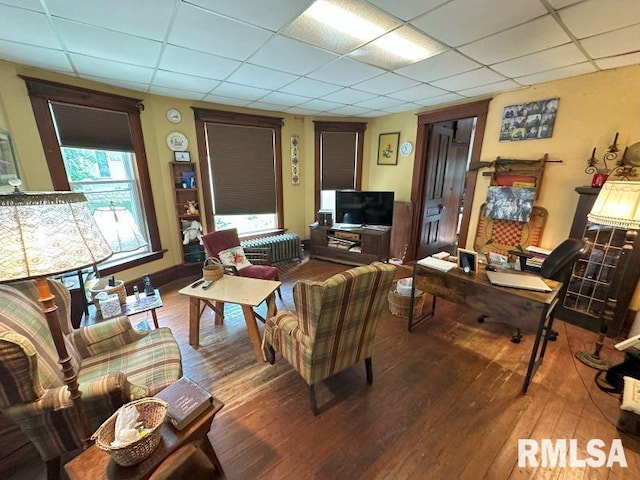605 Fulton St, Grand Mound, IA 52751 - living area with wood-type flooring and a paneled ceiling
