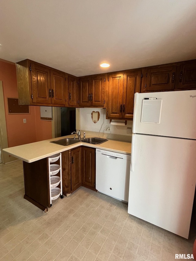 246 Willard St, Kewanee, IL 61443 - kitchen featuring white appliances, light countertops, a peninsula, brown cabinetry, and recessed lighting