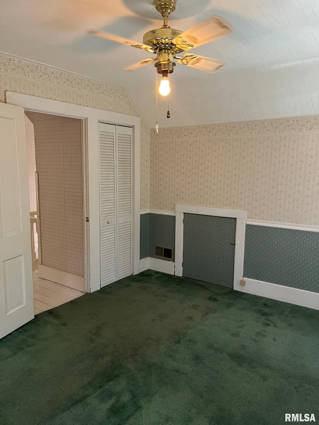 246 Willard St, Kewanee, IL 61443 - unfurnished bedroom with wallpapered walls, carpet flooring, a wainscoted wall, and ceiling fan