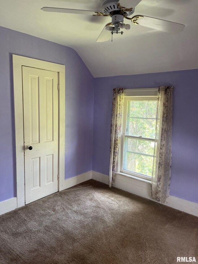 246 Willard St, Kewanee, IL 61443 - carpeted spare room featuring ceiling fan, vaulted ceiling, and baseboards