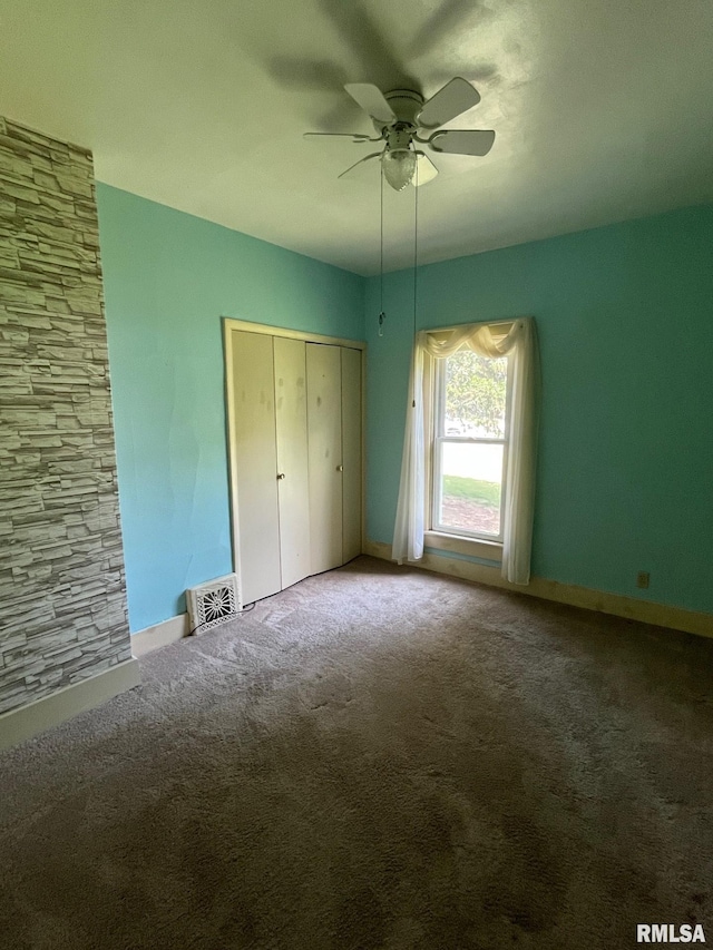 246 Willard St, Kewanee, IL 61443 - unfurnished bedroom featuring carpet flooring, baseboards, a closet, and a ceiling fan