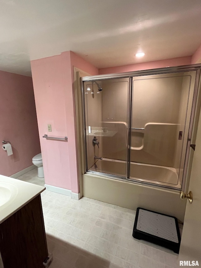 246 Willard St, Kewanee, IL 61443 - full bath featuring vanity, combined bath / shower with glass door, toilet, and baseboards