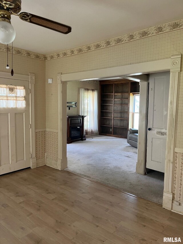 246 Willard St, Kewanee, IL 61443 - foyer entrance featuring wallpapered walls, wood finished floors, and a ceiling fan