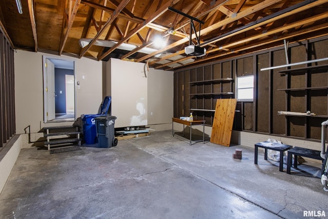 3461 Cedarview Ct, Bettendorf, IA 52722 - garage featuring a garage door opener