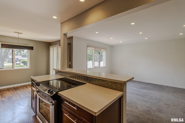 3461 Cedarview Ct, Bettendorf, IA 52722 - kitchen with stainless steel electric stove, baseboards, recessed lighting, light countertops, and dark brown cabinetry