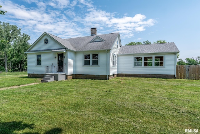 4418 11th St, East Moline, IL 61244 - view of front of home featuring a shingled roof and a chimney
