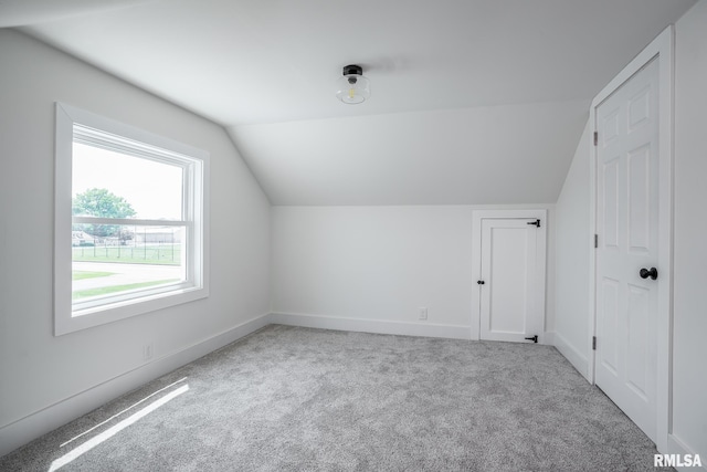 4418 11th St, East Moline, IL 61244 - bonus room with vaulted ceiling, carpet flooring, and baseboards