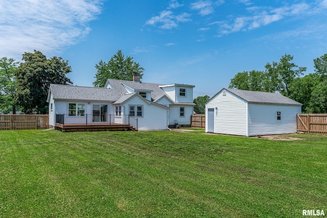4418 11th St, East Moline, IL 61244 - back of property featuring a wooden deck, a chimney, an outbuilding, and a shingled roof