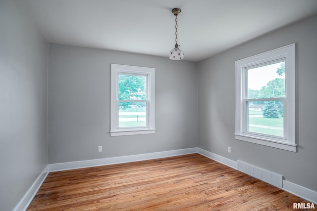 4418 11th St, East Moline, IL 61244 - unfurnished room with light wood finished floors and baseboards
