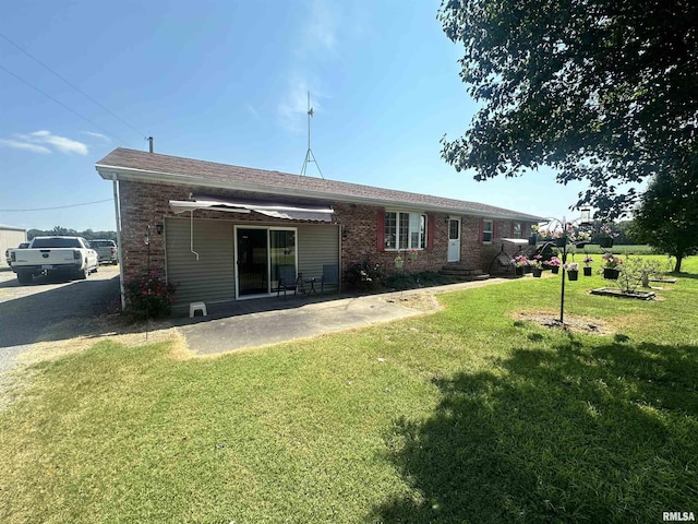 690 Railroad St, Tamms, IL 62988 - back of house featuring brick siding, a yard, and a patio area