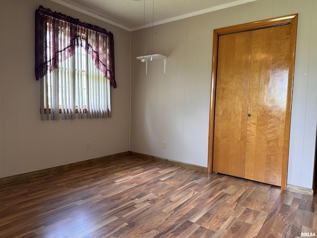 690 Railroad St, Tamms, IL 62988 - spare room with wood finished floors, ornamental molding, and a textured ceiling