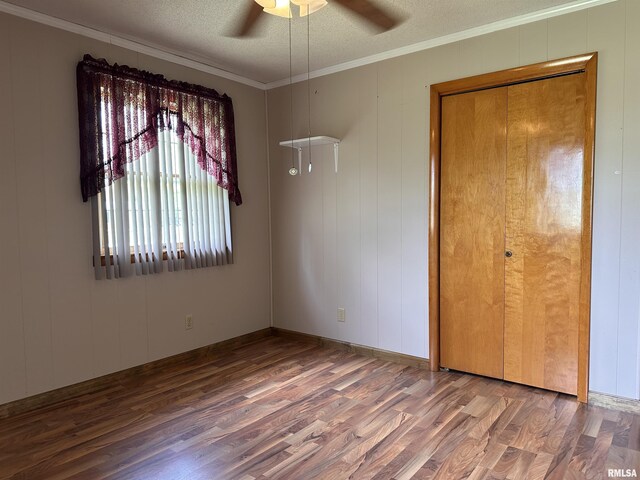 690 Railroad St, Tamms, IL 62988 - unfurnished bedroom featuring wood finished floors, a textured ceiling, crown molding, and a ceiling fan