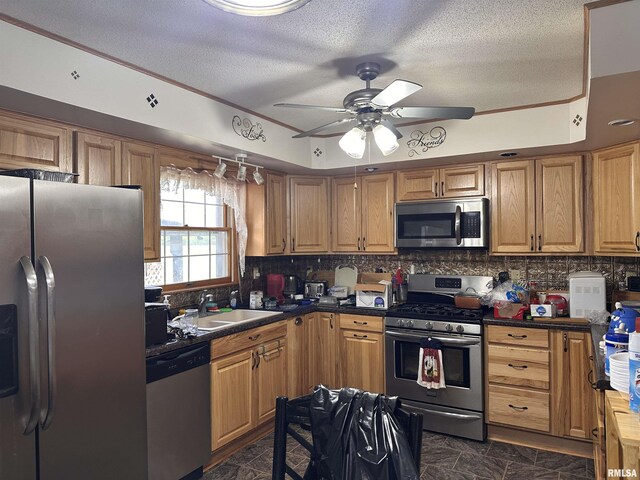690 Railroad St, Tamms, IL 62988 - kitchen featuring stainless steel appliances, a sink, ceiling fan, tasteful backsplash, and a textured ceiling