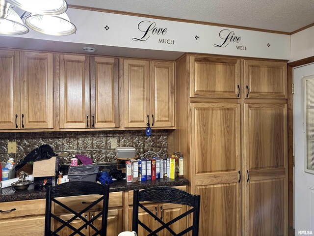 690 Railroad St, Tamms, IL 62988 - bar area featuring a textured ceiling, backsplash, and crown molding