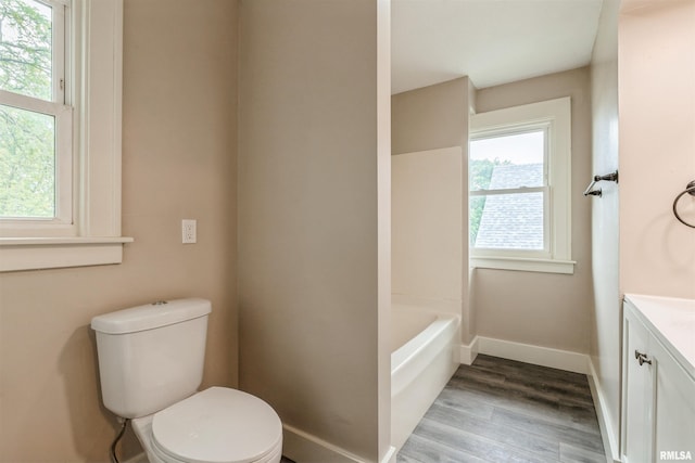 2037 18th St Unit B, Moline, IL 61265 - full bath with toilet, vanity, wood finished floors, and baseboards