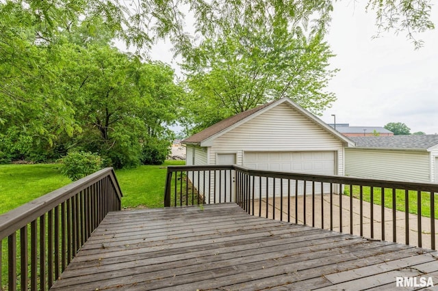 2037 18th St Unit B, Moline, IL 61265 - wooden terrace featuring a detached garage, a lawn, and an outbuilding