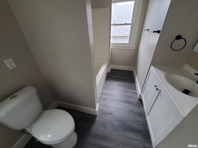 2037 18th St Unit B, Moline, IL 61265 - full bath with wood finished floors, toilet, vanity, and baseboards