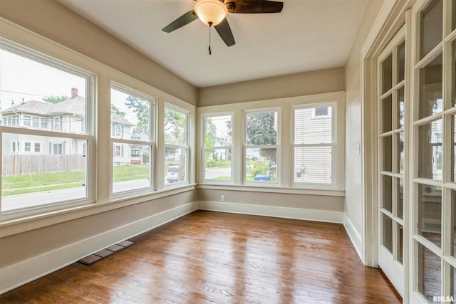 2037 18th St Unit B, Moline, IL 61265 - unfurnished sunroom featuring healthy amount of natural light, baseboards, and wood finished floors