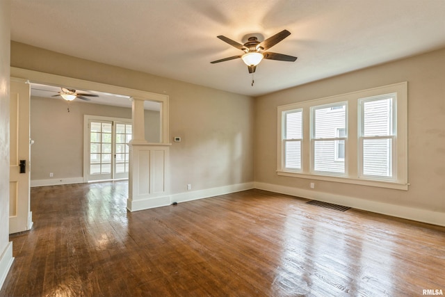 2037 18th St Unit B, Moline, IL 61265 - empty room with a ceiling fan, wood finished floors, baseboards, and decorative columns