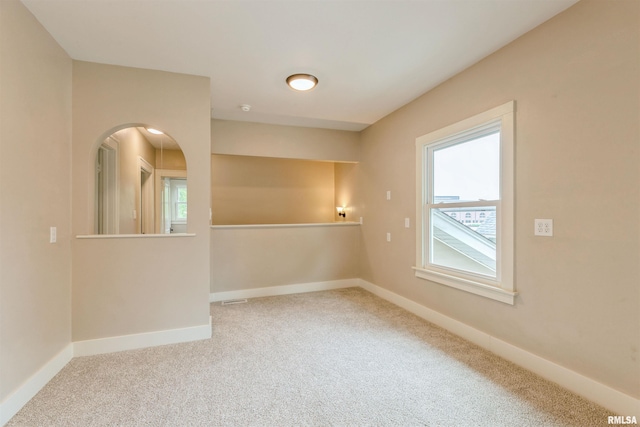 2037 18th St Unit B, Moline, IL 61265 - empty room with healthy amount of natural light, carpet, and baseboards