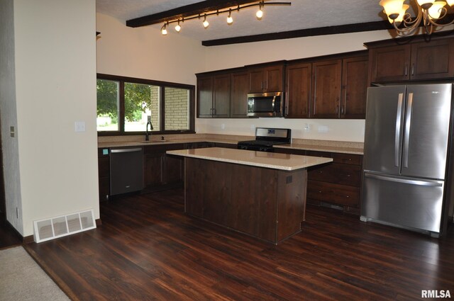 18616 N 35th Ave, East Moline, IL 61244 - kitchen with appliances with stainless steel finishes, vaulted ceiling, light countertops, a chandelier, and a center island