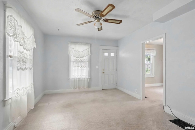 2947 12th Ave, Moline, IL 61265 - carpeted entryway featuring a ceiling fan and baseboards