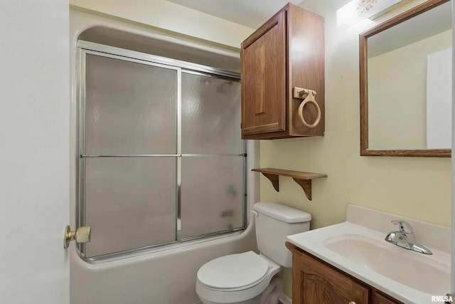 2947 12th Ave, Moline, IL 61265 - bathroom featuring vanity, toilet, and shower / bath combination with glass door