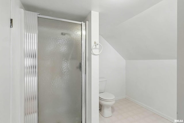 2947 12th Ave, Moline, IL 61265 - bathroom featuring tile patterned floors, a stall shower, toilet, lofted ceiling, and baseboards