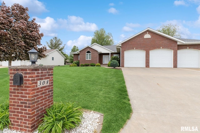 308 N 9th Ave N, Fulton, IL 61252 - single story home with a front yard, driveway, an attached garage, and brick siding