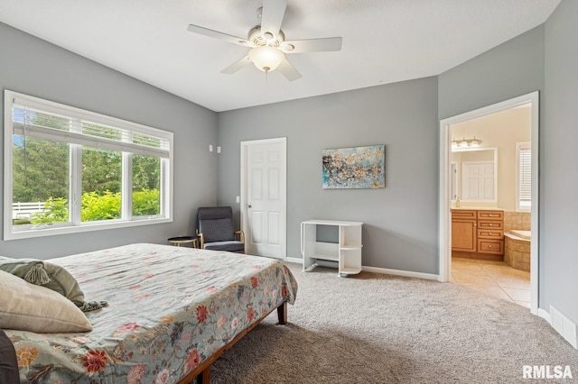 308 N 9th Ave N, Fulton, IL 61252 - bedroom featuring light colored carpet, baseboards, ensuite bath, and ceiling fan