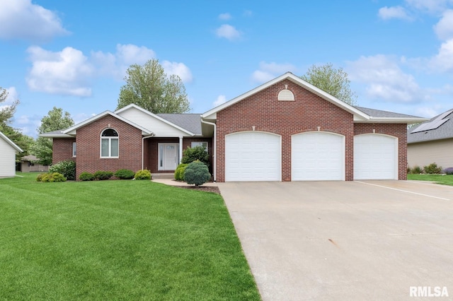 308 N 9th Ave N, Fulton, IL 61252 - ranch-style home featuring brick siding, a garage, a front lawn, and concrete driveway