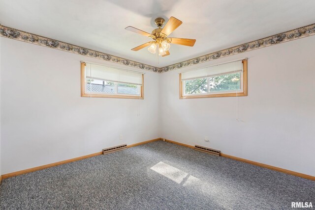 605 SW 5th Ave, Aledo, IL 61231 - unfurnished room with carpet floors, baseboards, ceiling fan, and a baseboard heating unit