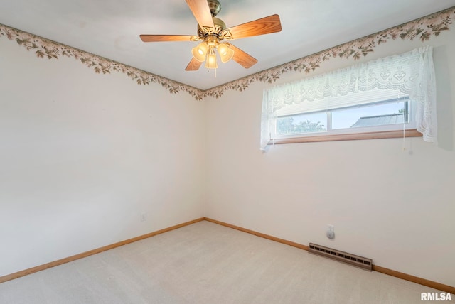 605 SW 5th Ave, Aledo, IL 61231 - unfurnished room featuring baseboards, light carpet, and a ceiling fan