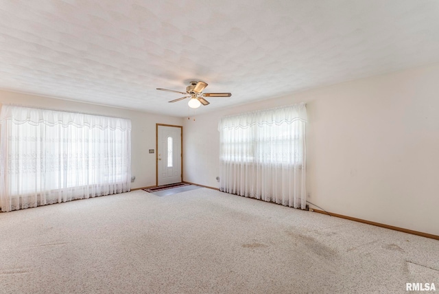 605 SW 5th Ave, Aledo, IL 61231 - spare room with carpet, a ceiling fan, and baseboards