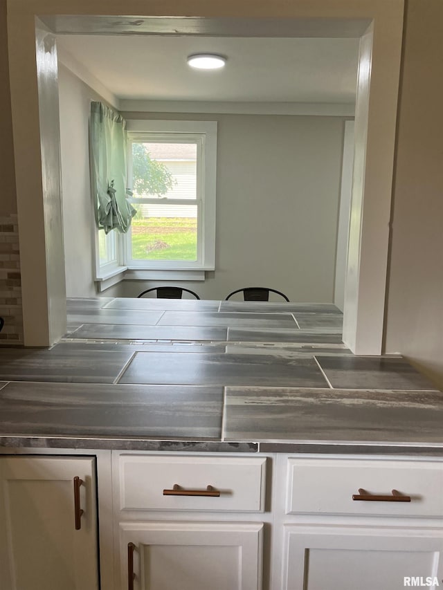 136 W Mill St, Kewanee, IL 61443 - kitchen with dark countertops and white cabinets